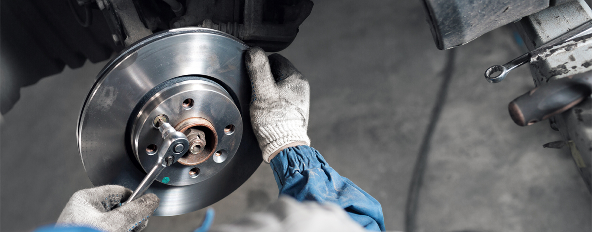 Mechanic checking a vehicles brakes - Brakes Heanor